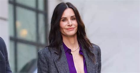 courtney cox lingerie|Courteney Cox flashes cleavage and lacy bra in a low